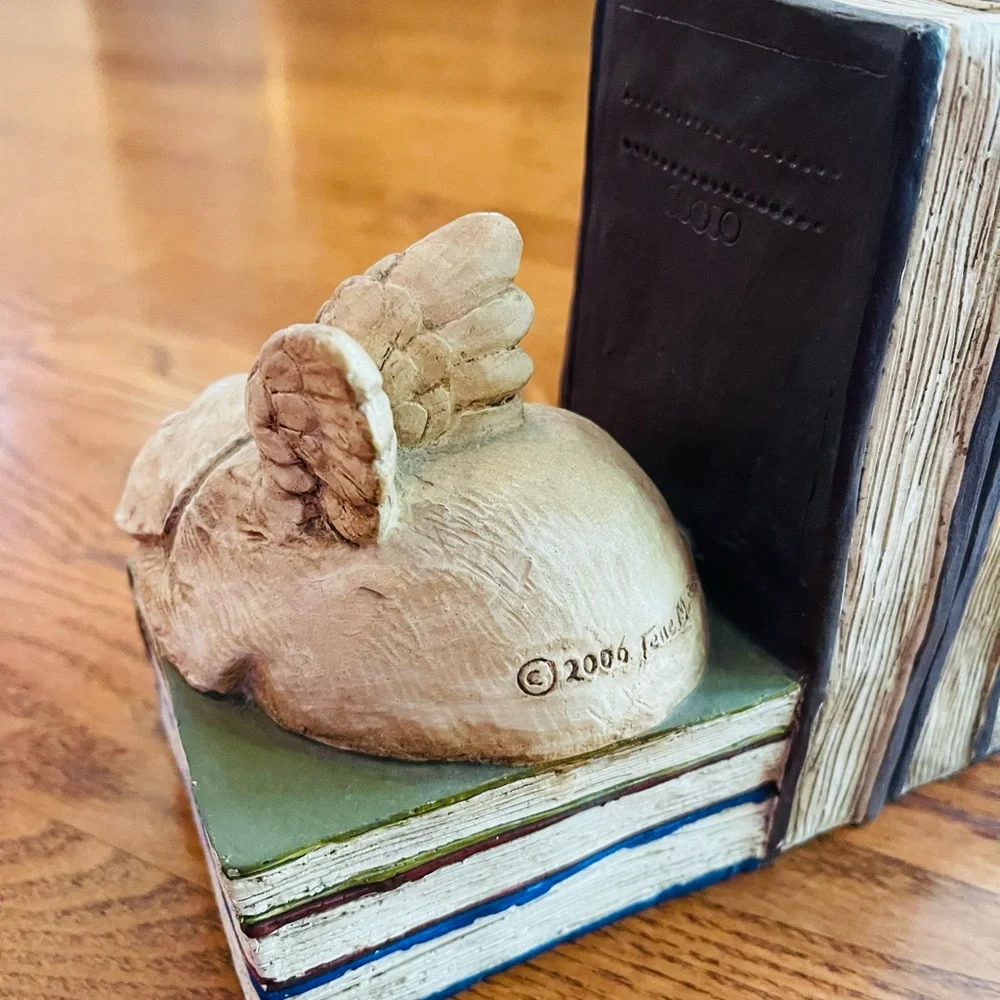 A pair of  stone bunny inc.2006 Telle M. Stein, Dog angel with ball bookends